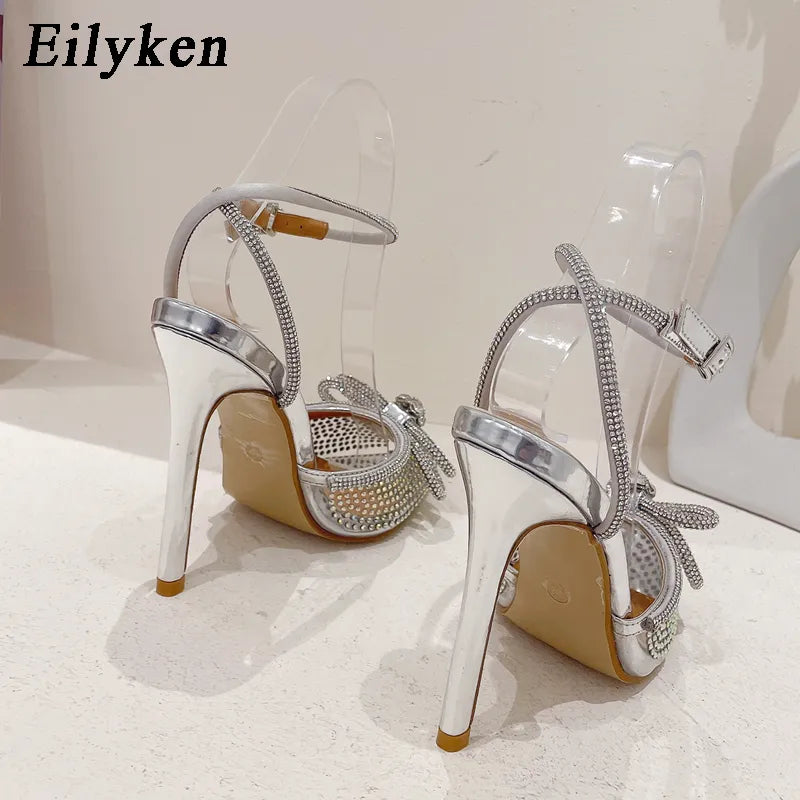 Eilyken New PVC Transparent Women Pumps Sexy Butterfly-knot CRYSTAL High Heels Pointed Toe Wedding Prom Sandals Spring Shoes